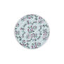 Round pocket mirror featuring a pattern of pink flowers and red bows on a pastel blue background.